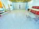 Spacious garage with epoxy flooring, ample storage, and a large overhead door at 3215 Peace River Dr, Punta Gorda, FL 33983