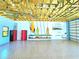 Garage featuring surfboard racks, an open rafter ceiling, epoxy floor, and a view from the window at 3215 Peace River Dr, Punta Gorda, FL 33983