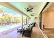 Outdoor lanai with ceiling fans and wicker furniture overlooking the screened in pool at 3215 Peace River Dr, Punta Gorda, FL 33983
