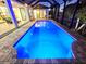 A private pool is surrounded by a brick patio and screened enclosure for relaxed, outdoor enjoyment at 3215 Peace River Dr, Punta Gorda, FL 33983