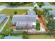Aerial shot of the home highlighting the backyard, patio, and fenced yard at 3803 Pin Oaks St, Sarasota, FL 34232
