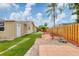 Backyard featuring well kept fence, manicured lawn, and outdoor patio area at 3803 Pin Oaks St, Sarasota, FL 34232
