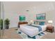 Bright bedroom featuring a large bed, stylish decor, and ample natural light at 3803 Pin Oaks St, Sarasota, FL 34232