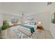 Inviting bedroom showcasing a comfortable bed, modern furniture, and ample natural light at 3803 Pin Oaks St, Sarasota, FL 34232