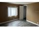 Bedroom offers a window and ample closet space at 125 Dolphin S Dr, Oldsmar, FL 34677