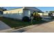 Well maintained single Gathering home features tidy landscaping and mature tropical foliage at 125 Dolphin S Dr, Oldsmar, FL 34677
