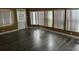 Bright living room features a wall of windows and lovely vinyl floors at 125 Dolphin S Dr, Oldsmar, FL 34677