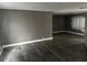 Large living room with neutral decor features modern vinyl floors at 125 Dolphin S Dr, Oldsmar, FL 34677