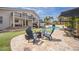 Inviting backyard with a pool, a putting green, and a cozy fire pit area for outdoor relaxation at 5900 Leeland S St, St Petersburg, FL 33715