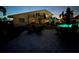 Expansive backyard featuring a luminous pool, putting green, and stylish patio furnishings at 5900 Leeland S St, St Petersburg, FL 33715