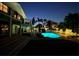 Stunning backyard with a luminous pool, manicured lawn, and a spacious lounging area at 5900 Leeland S St, St Petersburg, FL 33715