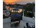 Picturesque backyard view overlooking the marina, featuring a sunset and stylish patio furniture at 5900 Leeland S St, St Petersburg, FL 33715