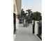 Second story balcony with seating provides a private outdoor space to relax, unwind and take in the outdoors at 5900 Leeland S St, St Petersburg, FL 33715