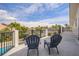 Upstairs balcony with two chairs provides beautiful views of the neighborhood's mature landscaping at 5900 Leeland S St, St Petersburg, FL 33715