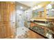 Elegant bathroom with walk-in shower, granite vanity, and stylish finishes at 5900 Leeland S St, St Petersburg, FL 33715
