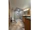 Modern bathroom with a glass-enclosed shower, granite countertops, and updated fixtures at 5900 Leeland S St, St Petersburg, FL 33715