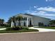 An inviting property with lush landscaping and a white driveway leading up to a grand entrance at 5900 Leeland S St, St Petersburg, FL 33715
