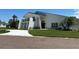 Beautiful home displaying a manicured lawn, an elegant front entrance, and architectural charm at 5900 Leeland S St, St Petersburg, FL 33715
