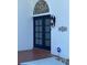 Beautiful front entrance with mosaic arched window, double doors, and address sign creates a welcoming curb appeal at 5900 Leeland S St, St Petersburg, FL 33715