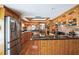 Spacious kitchen featuring custom wood cabinetry, granite countertops, and modern stainless appliances at 5900 Leeland S St, St Petersburg, FL 33715