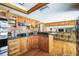 Well-equipped kitchen featuring custom wood cabinets, granite countertops, and modern appliances at 5900 Leeland S St, St Petersburg, FL 33715