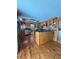 Bright kitchen with wood cabinetry, stainless steel appliances, wood flooring, and recessed lighting at 5900 Leeland S St, St Petersburg, FL 33715
