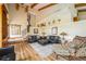 Open living room with wood floors, beamed ceilings, and a staircase to an upper level at 5900 Leeland S St, St Petersburg, FL 33715