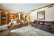 Cozy living room with ample seating, elegant rug, and stylish decor at 5900 Leeland S St, St Petersburg, FL 33715