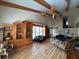 Large living room with wooden beams, hardwood floors, and custom wooden cabinets at 5900 Leeland S St, St Petersburg, FL 33715
