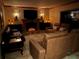 Comfortable living room with a fireplace, modern furniture, and warm lighting at 5900 Leeland S St, St Petersburg, FL 33715