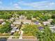 Aerial view showing homes with mature trees and green lawns, displaying the serene neighborhood at 909 Kirkcaldy Way, Valrico, FL 33594