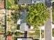 Aerial view of backyard and neighborhood, highlighting property lines, trees, and neighborhood at 909 Kirkcaldy Way, Valrico, FL 33594