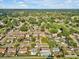 Overhead neighborhood shot, displaying the home's location among tree-lined streets at 909 Kirkcaldy Way, Valrico, FL 33594