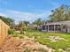 Large backyard with new fence and screened in patio at 909 Kirkcaldy Way, Valrico, FL 33594