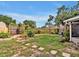 Backyard showcasing a green lawn, stepping stones, wood fence and potential outdoor space at 909 Kirkcaldy Way, Valrico, FL 33594