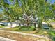 Charming single-story home with well-maintained lawn and mature tree providing ample shade at 909 Kirkcaldy Way, Valrico, FL 33594