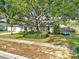 Charming single-story home with well-maintained lawn and mature tree providing ample shade at 909 Kirkcaldy Way, Valrico, FL 33594