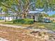 Charming single-story home with well-maintained lawn and mature tree providing ample shade at 909 Kirkcaldy Way, Valrico, FL 33594