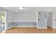 Bright living room featuring hardwood floors and sliding glass doors at 909 Kirkcaldy Way, Valrico, FL 33594
