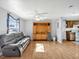 Open living area boasts a ceiling fan and flows into the adjacent kitchen at 909 Kirkcaldy Way, Valrico, FL 33594