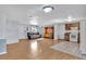 The large open living area has stylish flooring flowing into the adjacent kitchen at 909 Kirkcaldy Way, Valrico, FL 33594