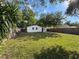 Large, well-maintained backyard featuring lush green grass and a sturdy privacy fence at 1121 49Th Ave N, St Petersburg, FL 33703