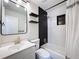 Chic bathroom featuring white subway tile, dark accents, and a modern vanity at 1121 49Th Ave N, St Petersburg, FL 33703