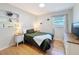 Cozy bedroom featuring hardwood floors, natural light, and plant decorations at 1121 49Th Ave N, St Petersburg, FL 33703