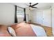 Bright bedroom with hardwood floors, window, a full length mirror and closet at 1121 49Th Ave N, St Petersburg, FL 33703