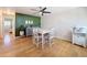 Cozy dining area with a modern gray accent wall, hardwood floors, and stylish decor at 1121 49Th Ave N, St Petersburg, FL 33703