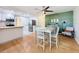 Cozy dining area featuring a green accent wall and a charming wooden table set at 1121 49Th Ave N, St Petersburg, FL 33703