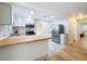 Kitchen with stainless steel appliances, butcher block countertops, white subway tile backsplash, and white cabinets at 1121 49Th Ave N, St Petersburg, FL 33703