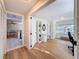 Open concept living room and office space with hardwood floors and neutral palette at 1121 49Th Ave N, St Petersburg, FL 33703