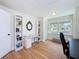 Bright office space featuring hardwood floors, built-in shelving, and a work area at 1121 49Th Ave N, St Petersburg, FL 33703